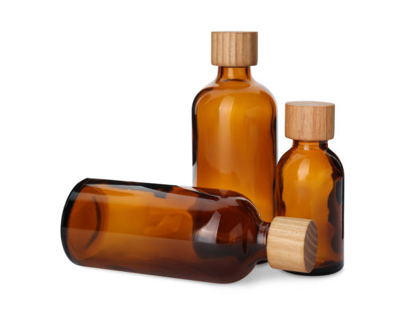 istock New empty glass bottles with wooden caps isolated on white 1474902533