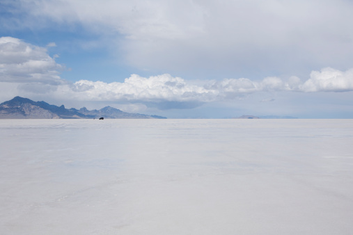 Person and SUV in the distance on the Bonneville Salt Flats in Utah