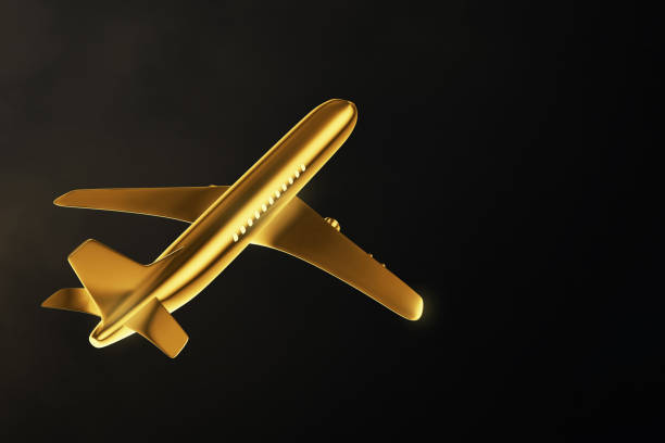 istock Golden airplane isolated on black background 1474912068