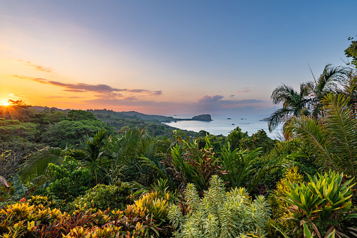 Vibrant sunrise over the wild untamed coastal beauty of Manuel Antonio National Park on the Pacific Coast of Costa Rica.