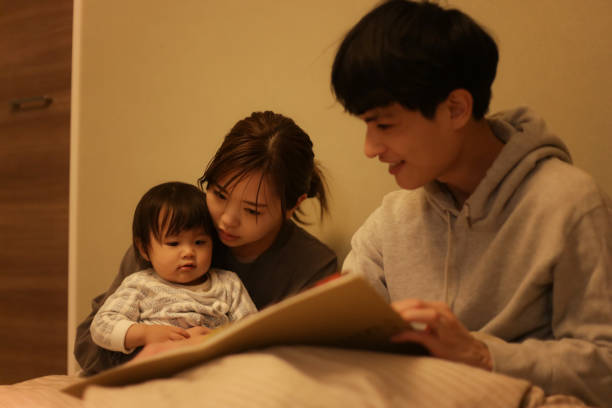 istock Parent and child reading a picture book 1474915691