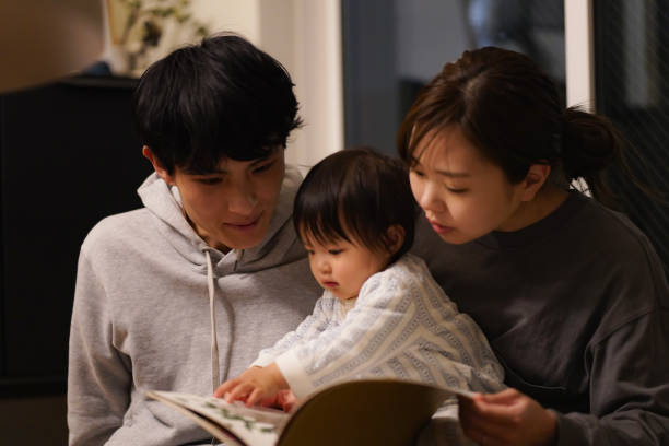 istock Parent and child reading a picture book 1474916267