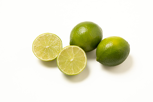 Citrus lime fruit with slice and half isolated on white background. Lime citrus fruit with clipping path