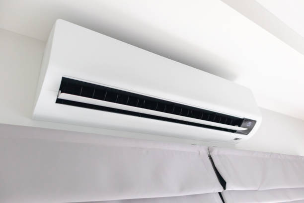 istock Air conditioner on white wall room interior background 1474919203
