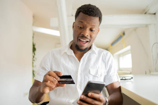 istock Man using her credit card to shop online 1474919708