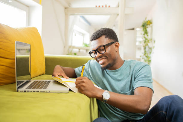 istock Young man working from home 1474919750