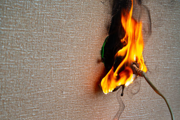 istock Fire of electrical wiring and electrical outlets. Faulty electrical wiring causes fires. 1474919887