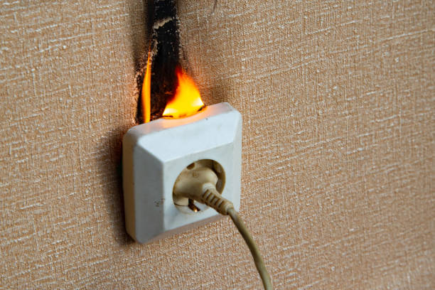 istock Fire of electrical wiring and electrical outlets. Faulty electrical wiring causes fires. 1474919898