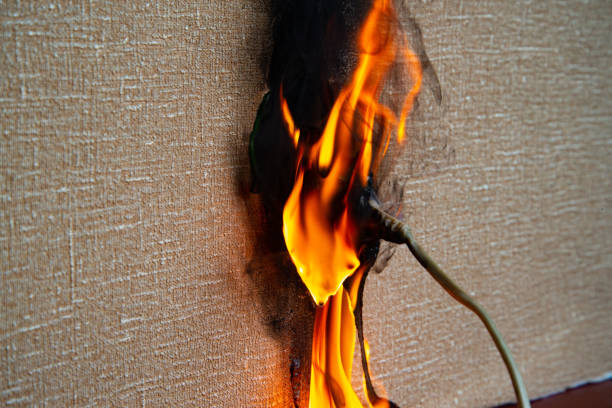 istock Fire of electrical wiring and electrical outlets. Faulty electrical wiring causes fires. 1474919904