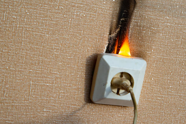 istock Fire of electrical wiring and electrical outlets. Faulty electrical wiring causes fires. 1474919907