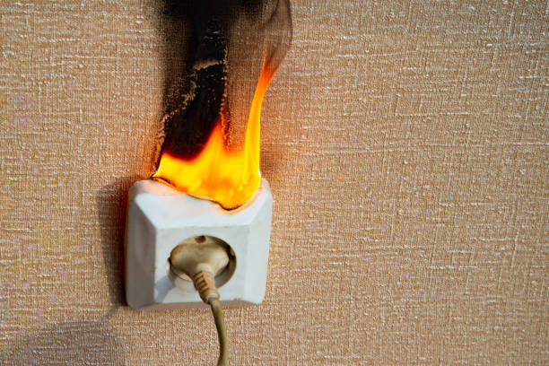 istock Fire of electrical wiring and electrical outlets. Faulty electrical wiring causes fires. 1474919908
