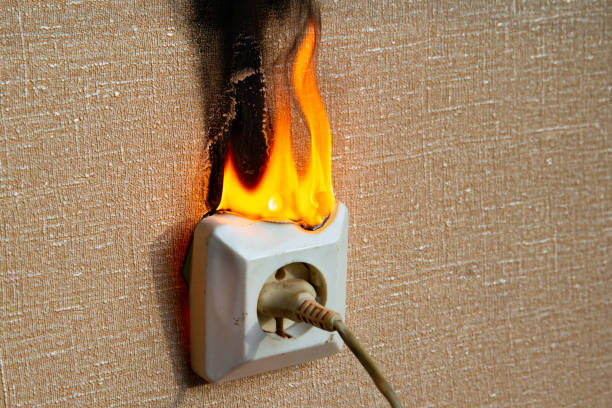 istock Fire of electrical wiring and electrical outlets. Faulty electrical wiring causes fires. 1474919909