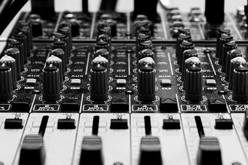 Black and white photo of a midi keyboard and dice