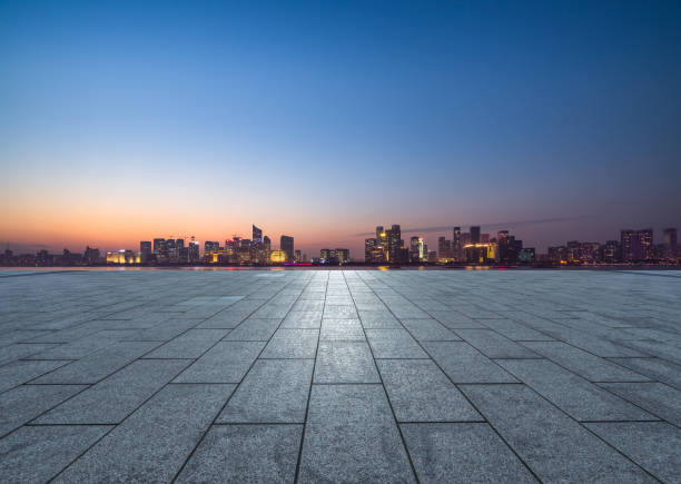 istock Panoramic skyline and buildings with empty square floor at dusk 1474928116