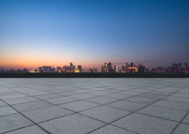 istock Panoramic skyline and buildings with empty square floor at dusk 1474928125