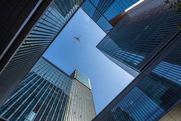 istock Plane flying over the skyscrapers 1474928190