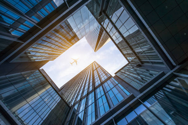 istock Plane flying over the skyscrapers 1474928194