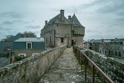 Wall of castle ruins, stone wall texture . \nMedieval castle ruins, old European architecture, ruined window of an old castle made of stone