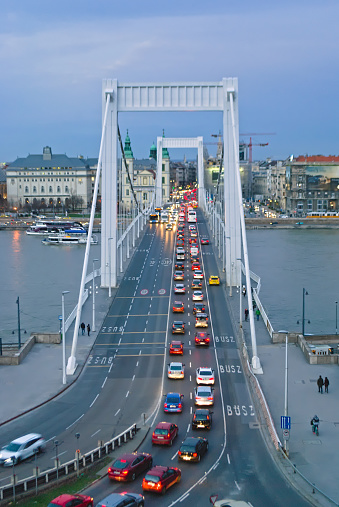 Erzsebet BrErzsebet Bridge in Budapest, Hungary, view from the hills, evening twilight, cars with headlights on, on the bridge