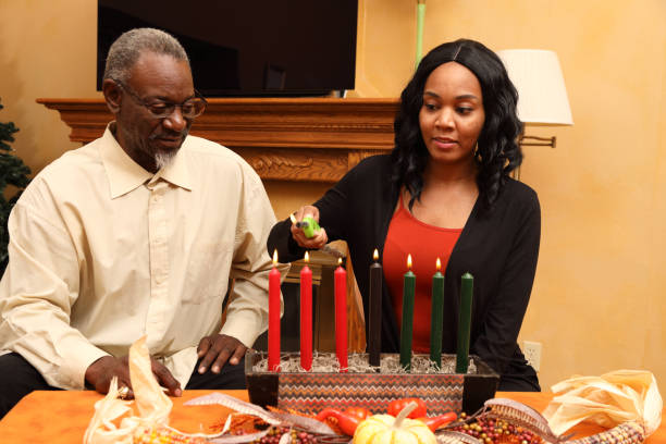 istock Kwanzaa Dad and Daughter Light Candles Horizontal 1474930103