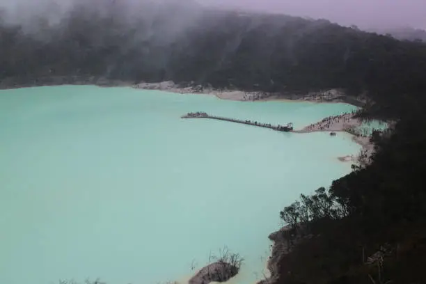 Landscape view of Kawah Putih from the Sunan Ibu Hills which is shrouded in mist in the morning.