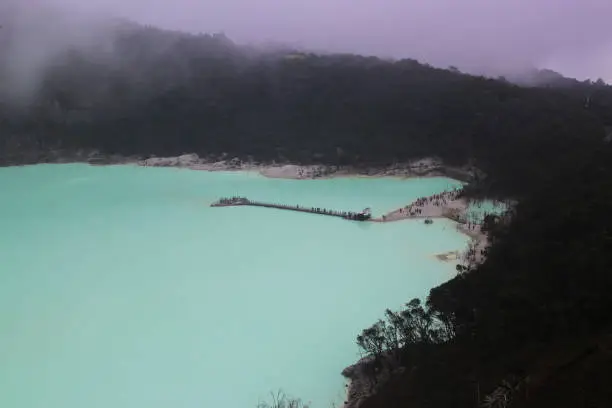 Landscape view of Kawah Putih from the Sunan Ibu Hills which is shrouded in mist in the morning.