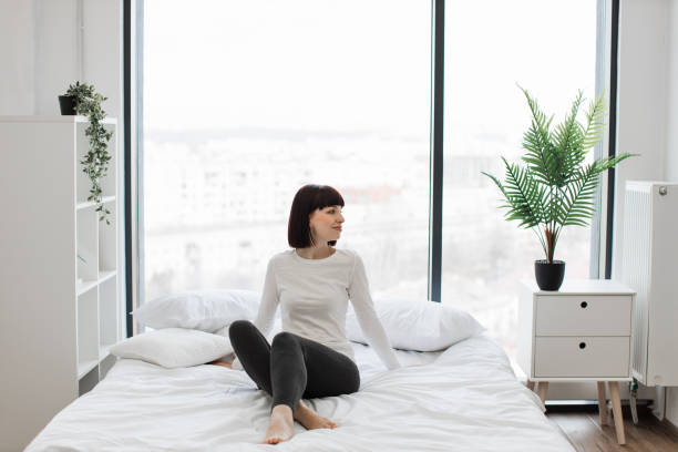 istock Caucasian woman resting at bedroom with panoramic windows 1474931591
