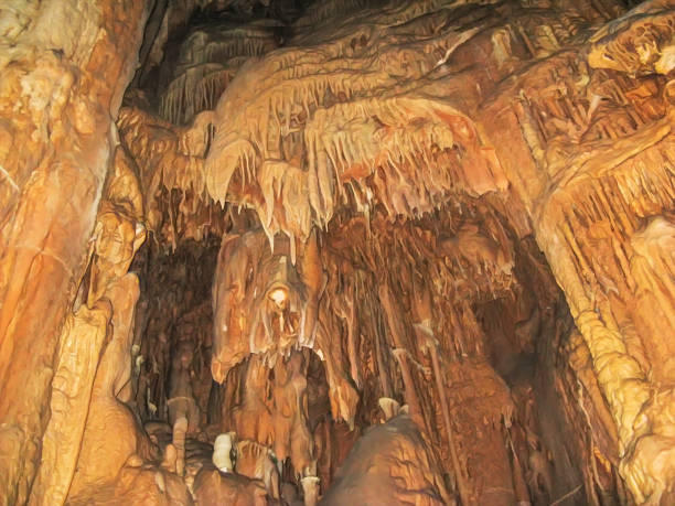 Abstract drawing of an underground cave with stalactites and stalagmites. Limestone karst formation. Travel and vacation concept. Digital painting. Abstract naturalism, relief pattern Abstract drawing of an underground cave with stalactites and stalagmites. Limestone karst formation. Travel and vacation concept. Digital painting. Abstract naturalism, relief pattern. digital underground stock pictures, royalty-free photos & images