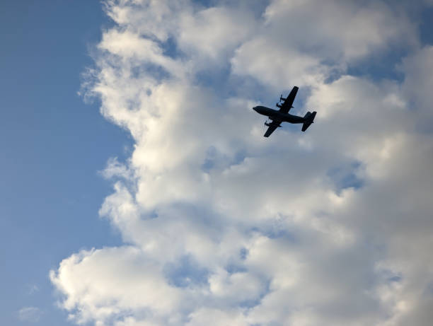 istock A military airplane flying in the sky 1474939673
