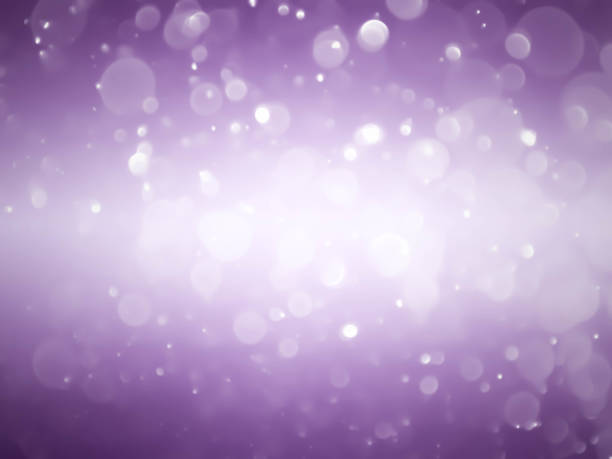 istock Purple bokeh abstract background caused by spray water. 1474939780