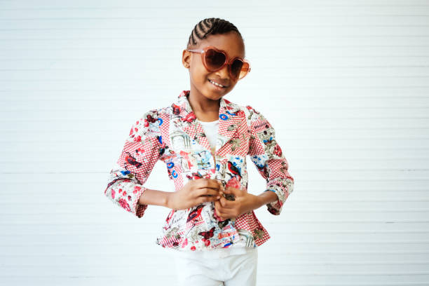 Girl wearing sunglasses against white background