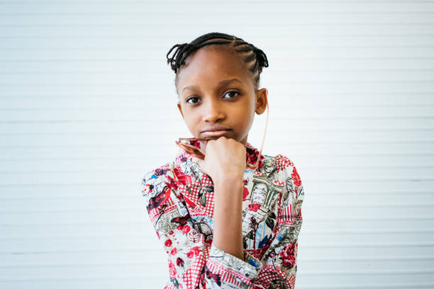 Cute African girl with sunglasses looking at the camera