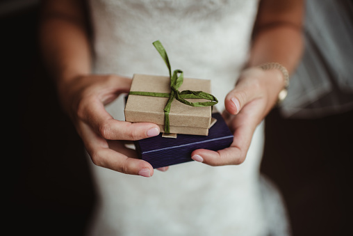 Woman holding wrapped presents in her hands