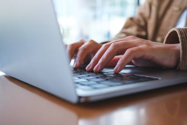 istock Closeup image of a woman working and typing on laptop computer keyboard 1474950653
