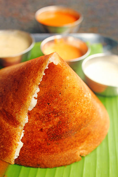Popular south indian breakfast Masala Dosa and chutney on white stock photo