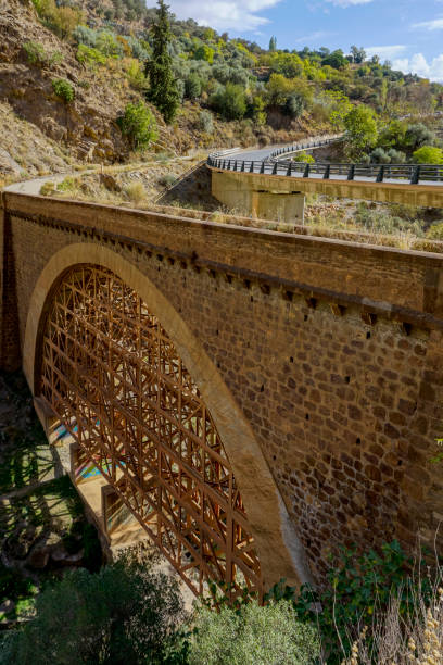 istock stone bridge with wooden reinforcements at the bottom 1474952381