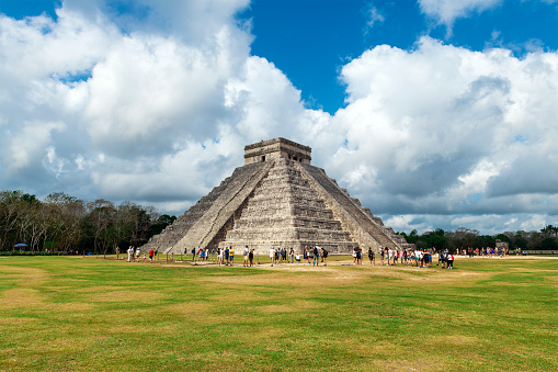 Kukulcan pyramid with tourists people, Chichen Itza, Yucatan, Mexico.