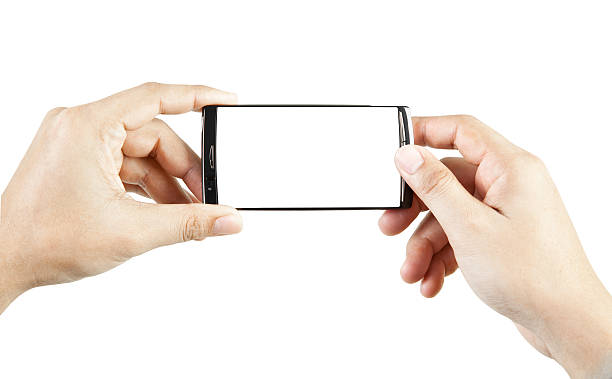 istock Hand holding and touch smart phone 147495513