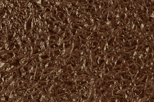 istock Shiny brown foil texture background, pattern of wrapping paper with crumpled and wavy. 1474955976