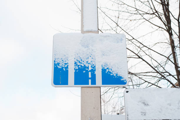 istock Snow covered road sign on a pole 1474957078