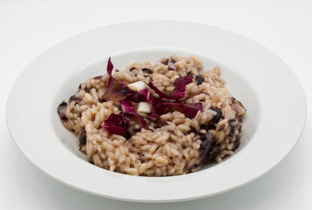 istock Italian Risotto al radicchio rosso (Risotto with red radicchio) in a white dish 1474962277