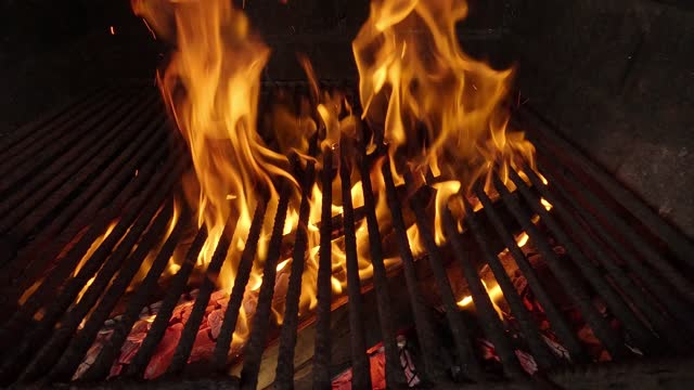 burning firewood in a grill