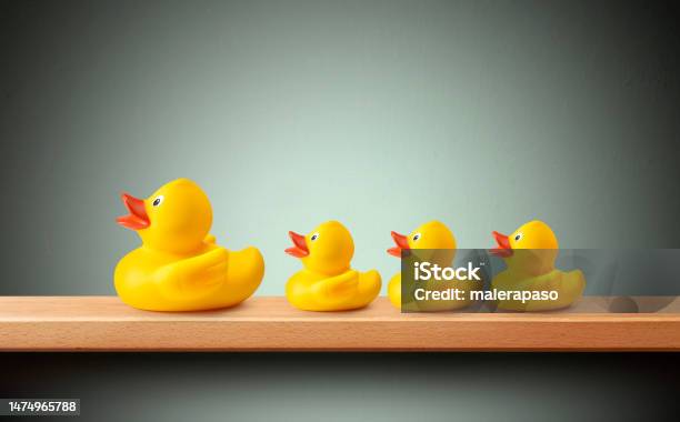 Rubber Duck And Ducklings In A Row Stock Photo - Download Image Now - Four Objects, Rubber Duck, Toy