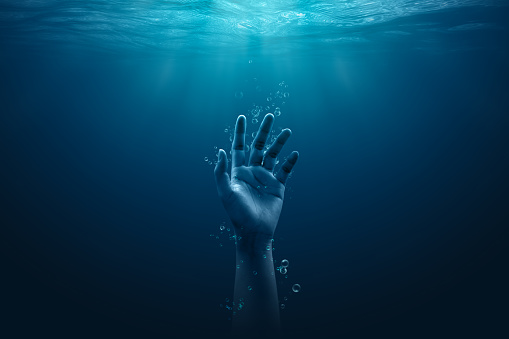 Despair drowning hand underwater danger help accident on urgency sos dangerous water background of emergency problem rescue ocean swimming warning risk or saving life reaching hopeless alone concept.