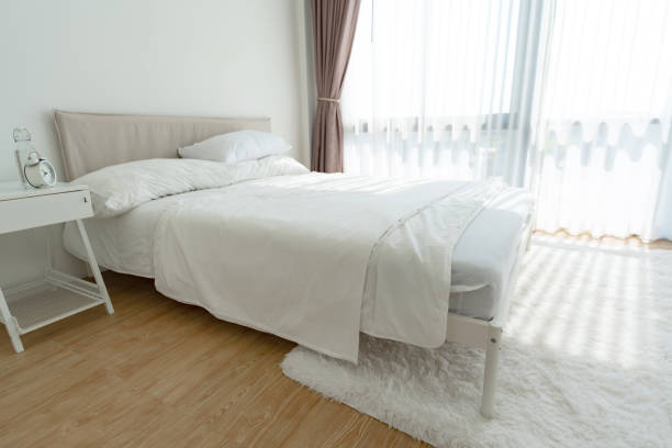 istock White bedroom with white curtains and white pillows 1474975870