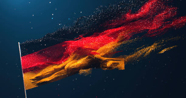 The flag of Germany is fluttering like sand in the wind on a dark turquoise background. Topics related to Germany. 3D rendering of the German flag waving in the wind on a dark background. Sand painting in the colors of the German flag.