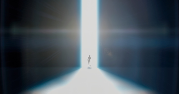 A tiny dark silhouette of a man in the distance walking into the darkness, a ray of white light hits him in the back, he walks forward without looking back