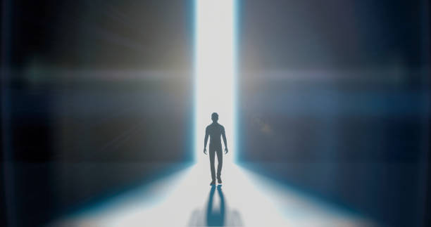 istock A man walks in a beam of snow-white light 1474976432