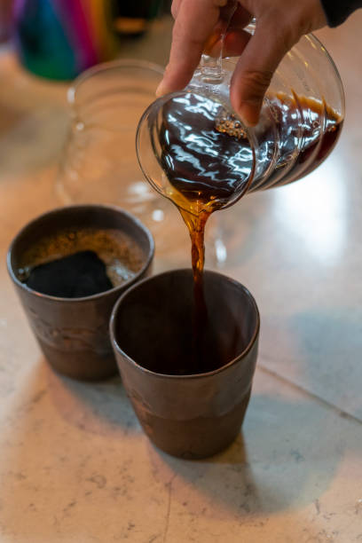 istock Pouring coffee from a V60 server into the favorite cup 1474977202