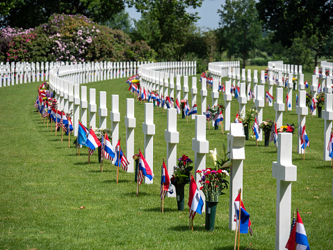 White crosses on the graves of American soldiers who died in World War II at the Netherlands American Cemetery and Memorial at Margraten in the Dutch province of Limburg. The Netherlands American Cemetery and Memorial is the only American military cemetery in the Netherlands. Every grave at Netherlands American Cemetery has been adopted by a local citizen.